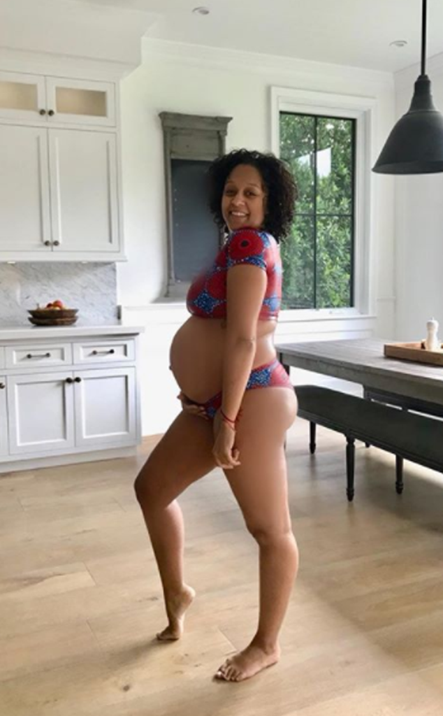 Tia Mowry ''Embraces'' Her Growing Baby Bump in New Bikini Pic E